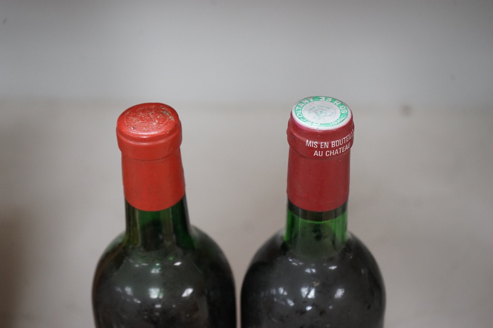 Two bottles of red wine; Chateau Troplong Mondot 1962 together with Moulin des Carruades 1978
